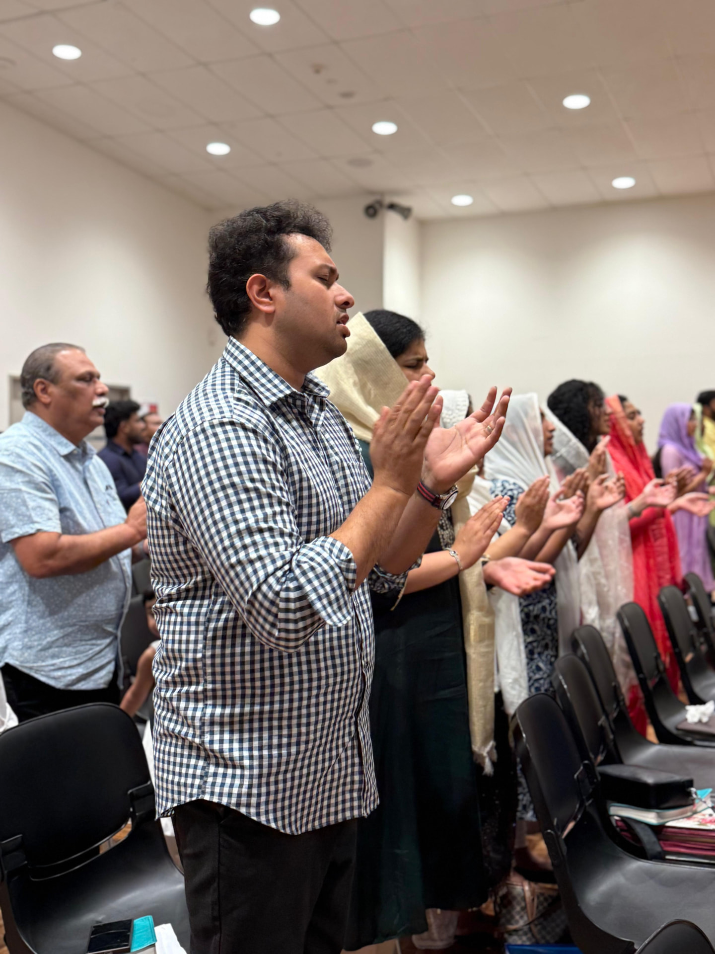 Congregation standing in prayer